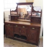 A substantial oak Edwardian sideboard with mirrored top