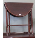 An Edwardian mahogany gate leg table