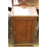 An Edwardian mahogany pot cupboard with upstand