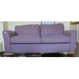 A DFS lilac two seater sofa