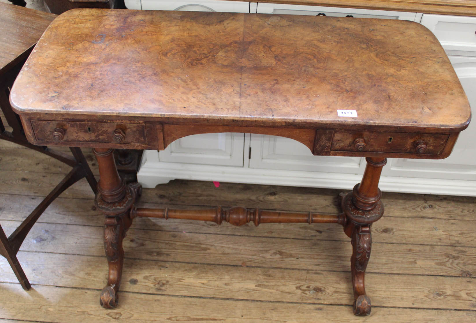 A Victorian burr walnut and mahogany two drawer desk