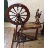 An early 20th Century oak spinning wheel