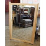 A modern oak overmantel mirror