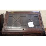 An early 19th Century oak hanging glazed corner cabinet