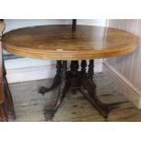 A Victorian inlaid mahogany oval dining table