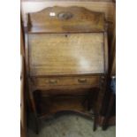 An Arts and Crafts inlaid oak desk with one drawer,