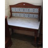 An Edwardian mahogany marble washstand with tiled upstand