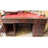 A reproduction mahogany pedestal desk with red leather top