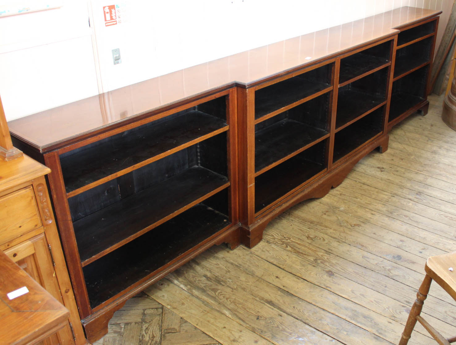 Maples inlaid mahogany breakfront bookshelves,