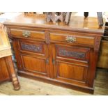 An Edwardian mahogany two door two drawer sideboard (missing top)