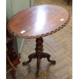 A Victorian mahogany tripod table with oval top