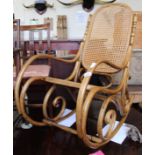 A modern bentwood cane rocking chair