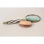 A magnifying glass with chequered handle plus a mother of pearl purse