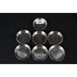 Seven Arabic white metal coasters