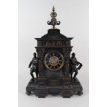 A 19th Century French black marble and patinated brass mantel clock,