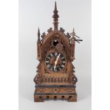 An oak cased steeple cuckoo clock