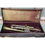 A cased brass 'student' trumpet