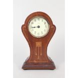 An Art Nouveau inlaid mahogany mantel clock