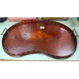 An Edwardian inlaid mahogany kidney shaped tray with shell paterae