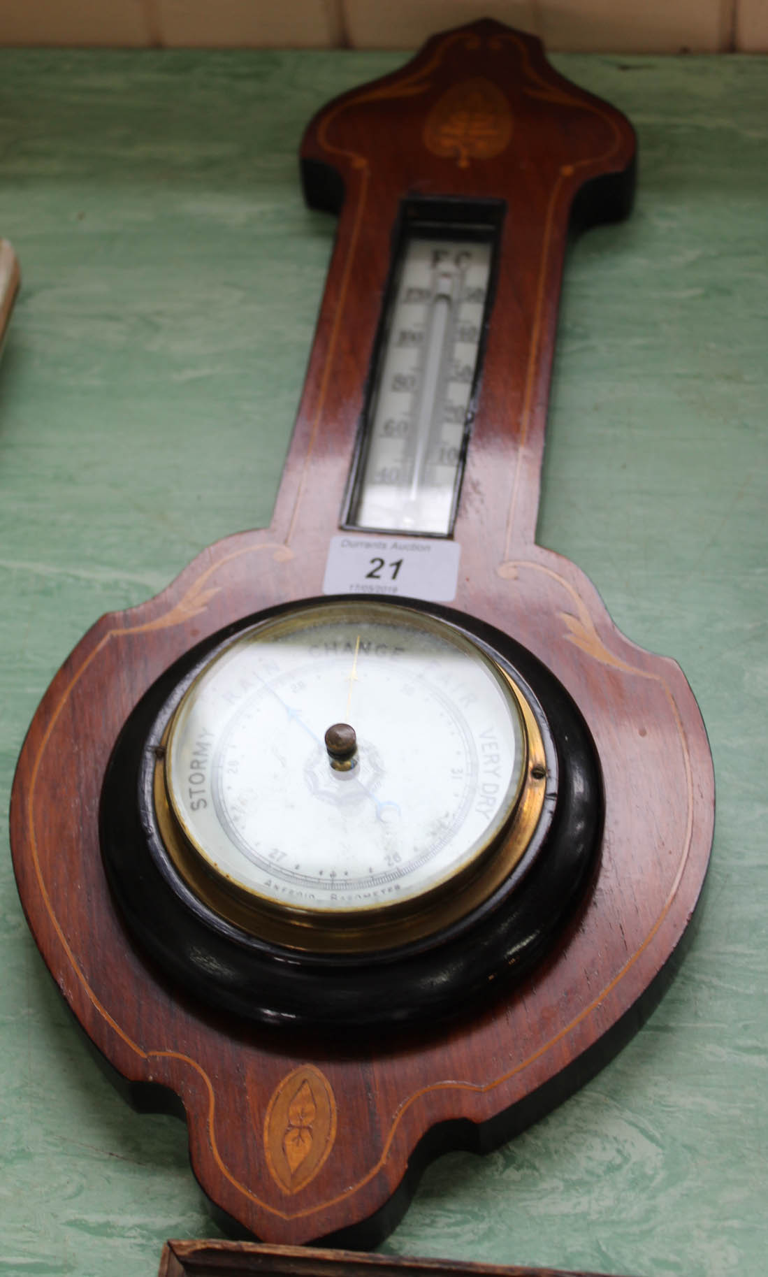 An inlaid mahogany barometer