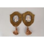 A pair of miniatures of ladies with rose decoration in brown velvet frames