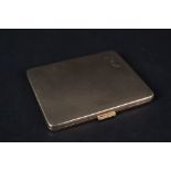 A 9ct gold cigarette case with engine turned decoration (inscription inside case)