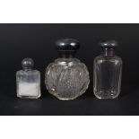Three silver top scent bottles