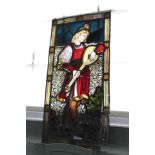 A stained glass panel of a pre raphaelite musician (as found),