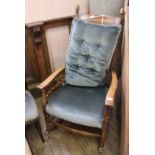 A 1920's oak ladder back rocking chair