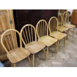 A harlequin set of six light Ercol dining chairs