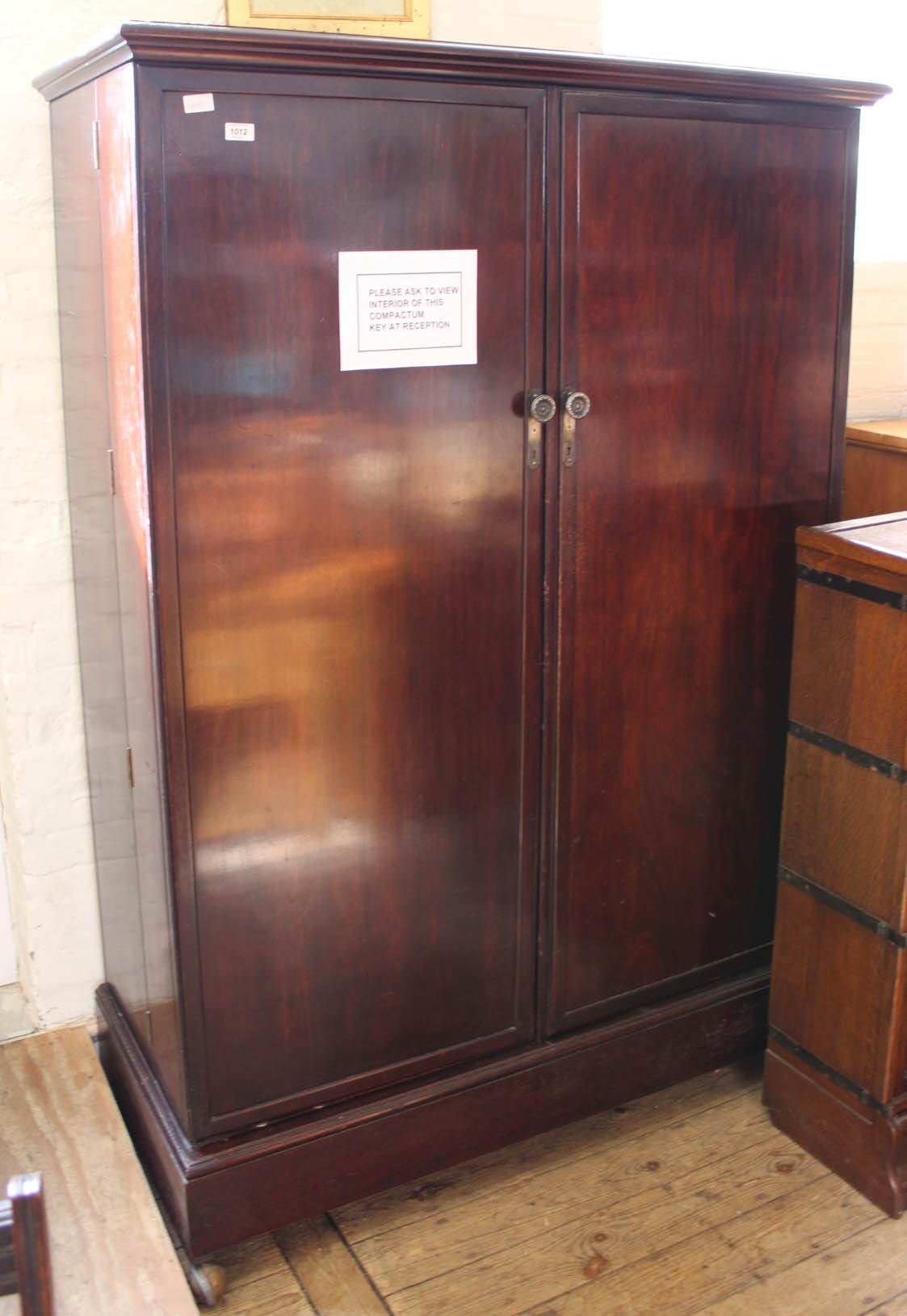 A 1930's two door mahogany gentleman's compactum wardrobe marked Comptactum Patent No.