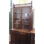 An Edwardian mahogany cupboard bookcase