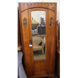 An Edwardian satinwood single mirrored wardrobe (missing cornice)