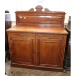 An Edwardian American walnut chiffoniere with upstand