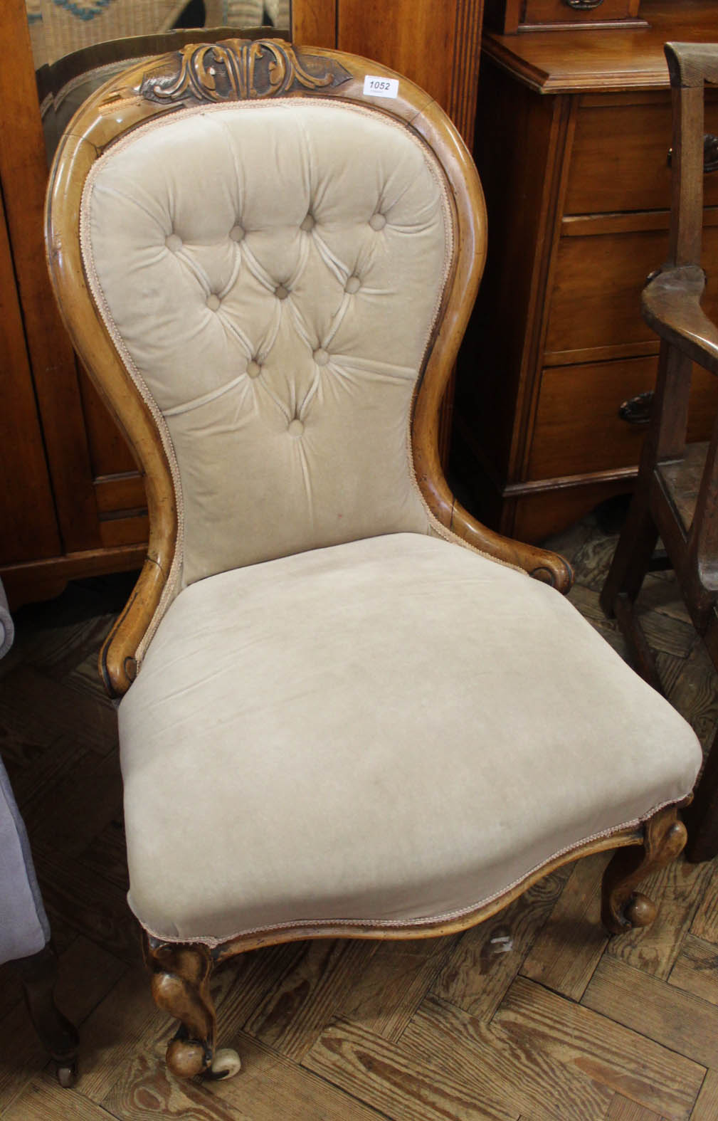 A Victorian mahogany balloon back lounge chair