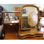 A Victorian mahogany swing toilet mirror and two door carved mahogany hanging shelves