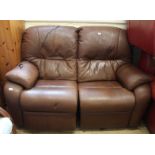 A two seater electronic brown leather recliner