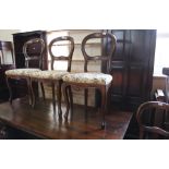 A set of four rosewood balloon back dining chairs (as found)