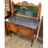 An Edwardian satinwood marble washstand with original tile upstand
