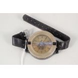 A WWII era Luftwaffe wrist compass with leather strap,