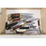 A box of various pocket knives