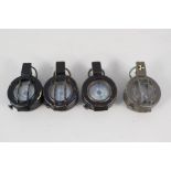 Four military compasses,