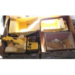 Three Tonka trucks plus a glazed workshop diorama