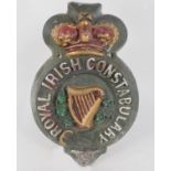 A large cast metal 'Royal Irish Constabulary' painted badge/plaque,