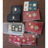 A box of assorted cased sets of UK, USA,