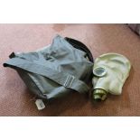 A post war German gas mask with carry case