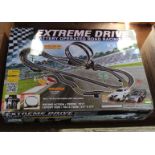 A boxed Extreme Drive racing set