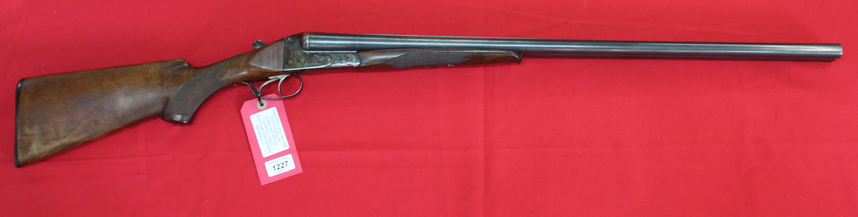 A 12 bore S/S B/L/E shotgun by Baikal (2 3/4 Magnum ejector), S/No.