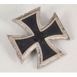A WWII German Iron Cross 1st class with pin back (no makers mark)