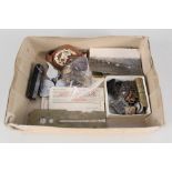 A box of various military related items including badges,